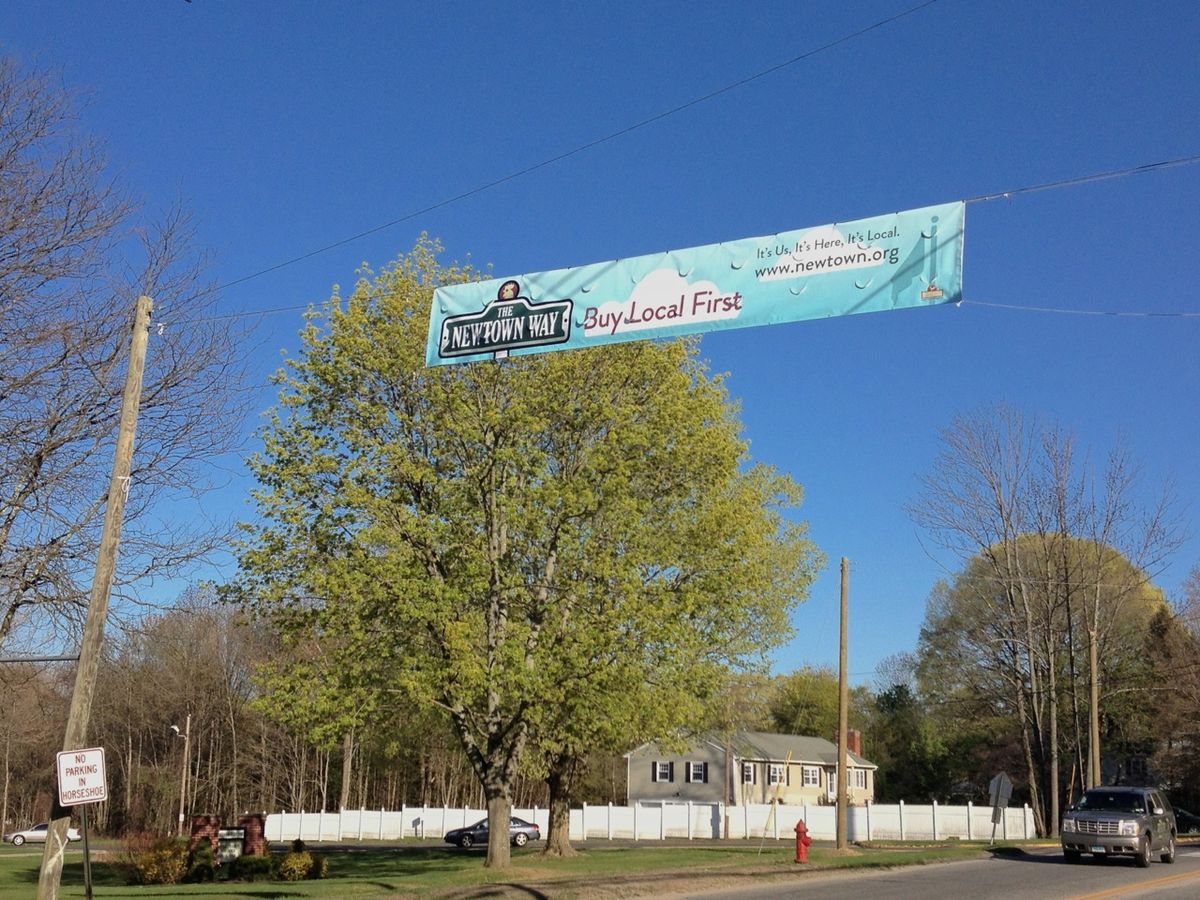 The Newtown Way banner along the road